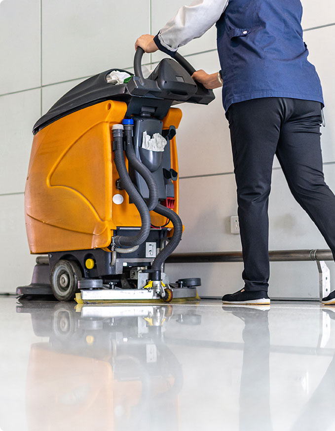Cropped image of a professional cleaner using an industrial floor cleaner.